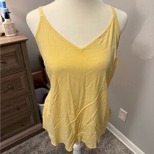 Light pale yellow tank top.